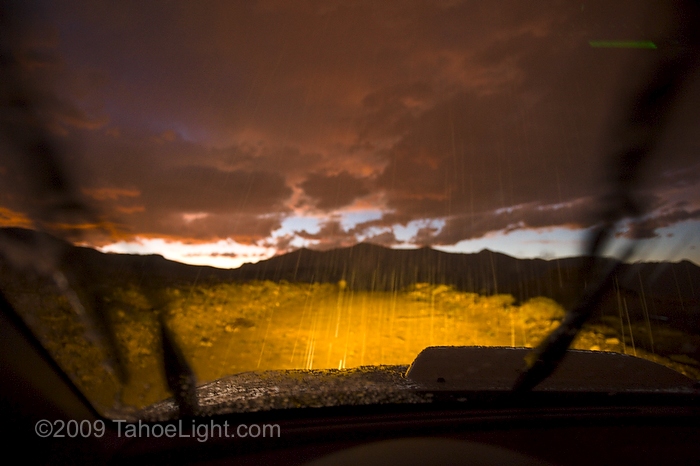 Hail storm seen through a car window while driving A brief hail storm caught us as we were driving the dirt roads chasing lightning around sunset. It kept us pinned down for a bit.