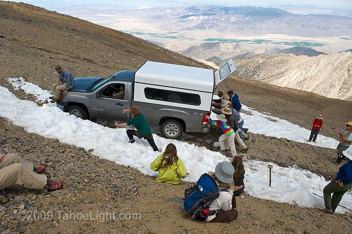 Getting one of the equipment vehicles unstuck after finishing up the species count on  the 14,000 foot summit of White Mountain for the first US 5-year resurvey as part of the Global Observation Research Initiative in Alpine Environments or (GLORIA) climate change survey at the first US master-site in the White Mountains. The University of California