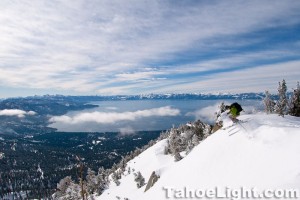 Dropping off the top of Incline Peak with Tahoe in the background.