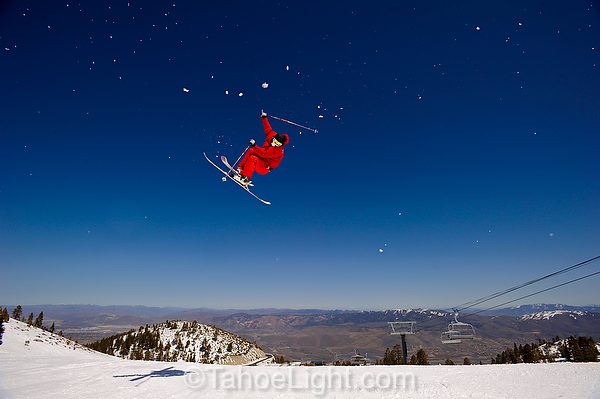 big air with desert background on skis.