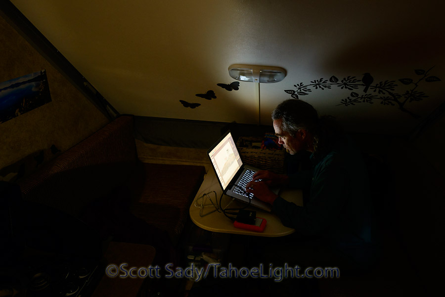 editing photos in the Aliner as the rain beats down