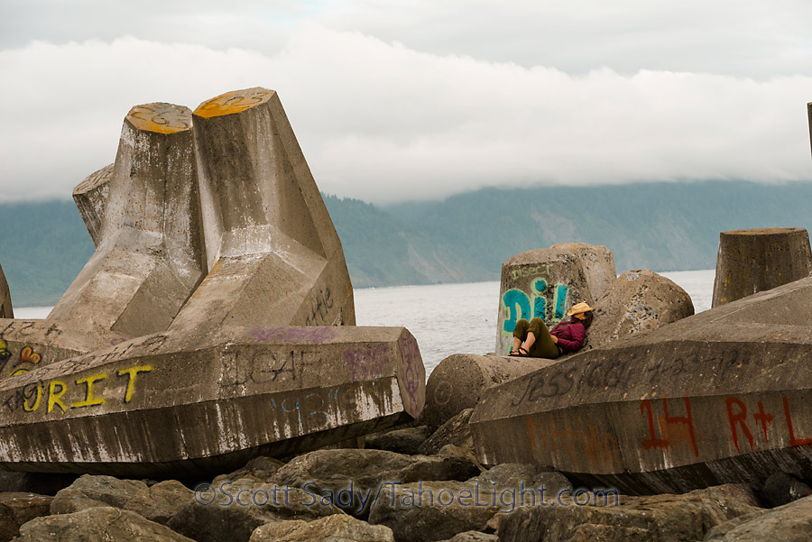 Monique taking a nap on the giant cement formation on the Cresent City jetty.
