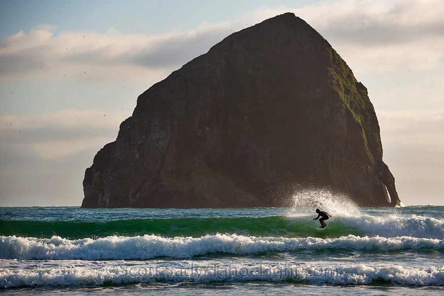 We made Pacific City and Cape Kiwanda near sunset. Again, our destination was farther north, and again, probably a mistake as the Cape Kiwanda area has some of the most scenic coastline I came across. Here a surfer slices in front of the Haystack rock as seen from the patio of the Pelican Bay brewery while drinking a beer. Now where else can you get a shot like this from your seat while drinking a local brew?