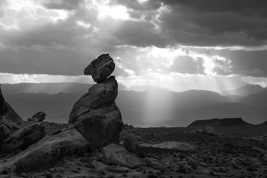 Balancing rock is one of the formations right next to the visitors center. There is a trail up to it from the bottom, and the road winds right by it with no place to stop except below it, where the backgrounds were boring. I wouldn't have taken a picture of this rock, except while coming down from my sunrise shooting, there were beams of light passing behind it.