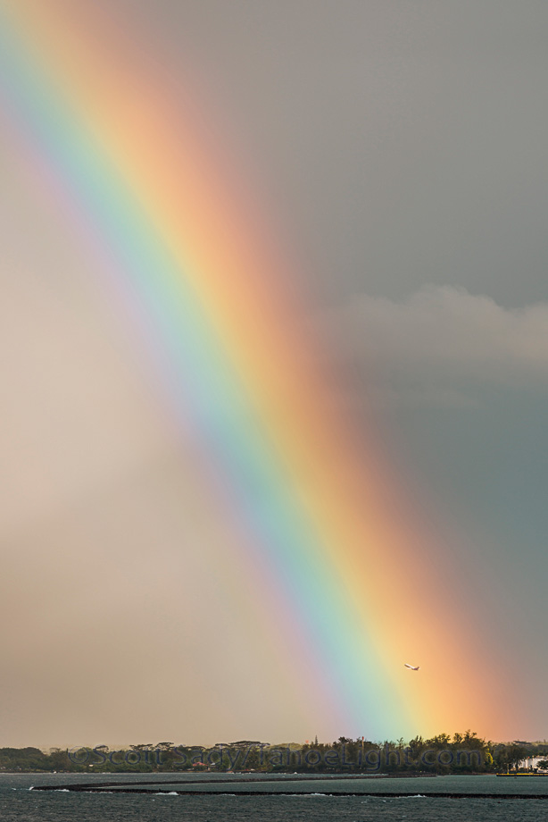 Rainbow over the airport in Hilo as planes com in for landings.