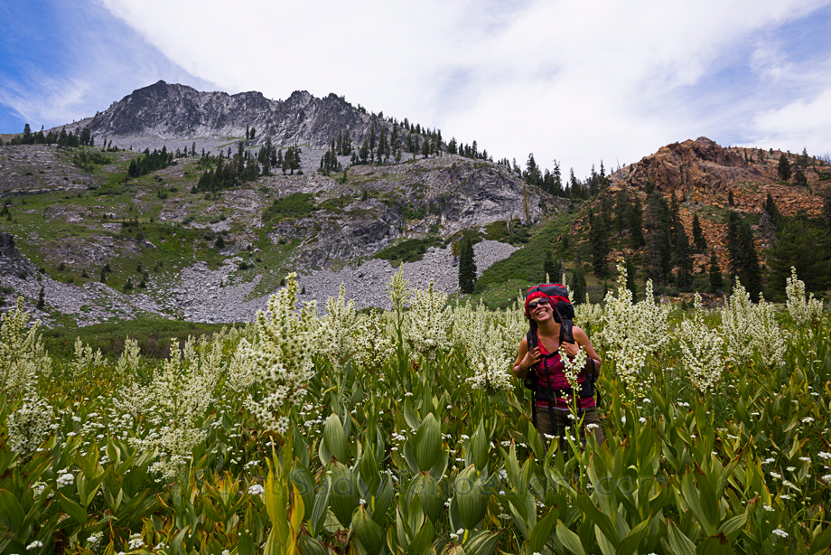 Monique in corn lillies taller than her near Round Lake