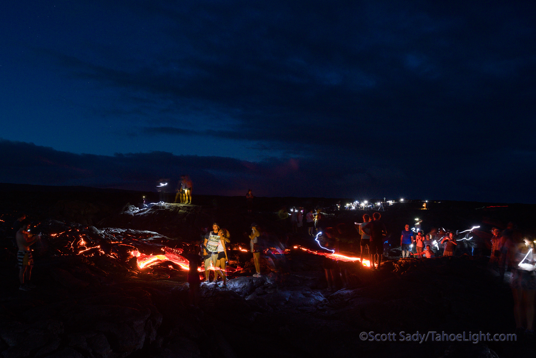 Sunset on the lava flows reminds me of Burning man. It is way too crowded and there are a lot of people doing a lot of silly things just because they see other people doing it, like walking across glowing lava rock in tennis shoes.
