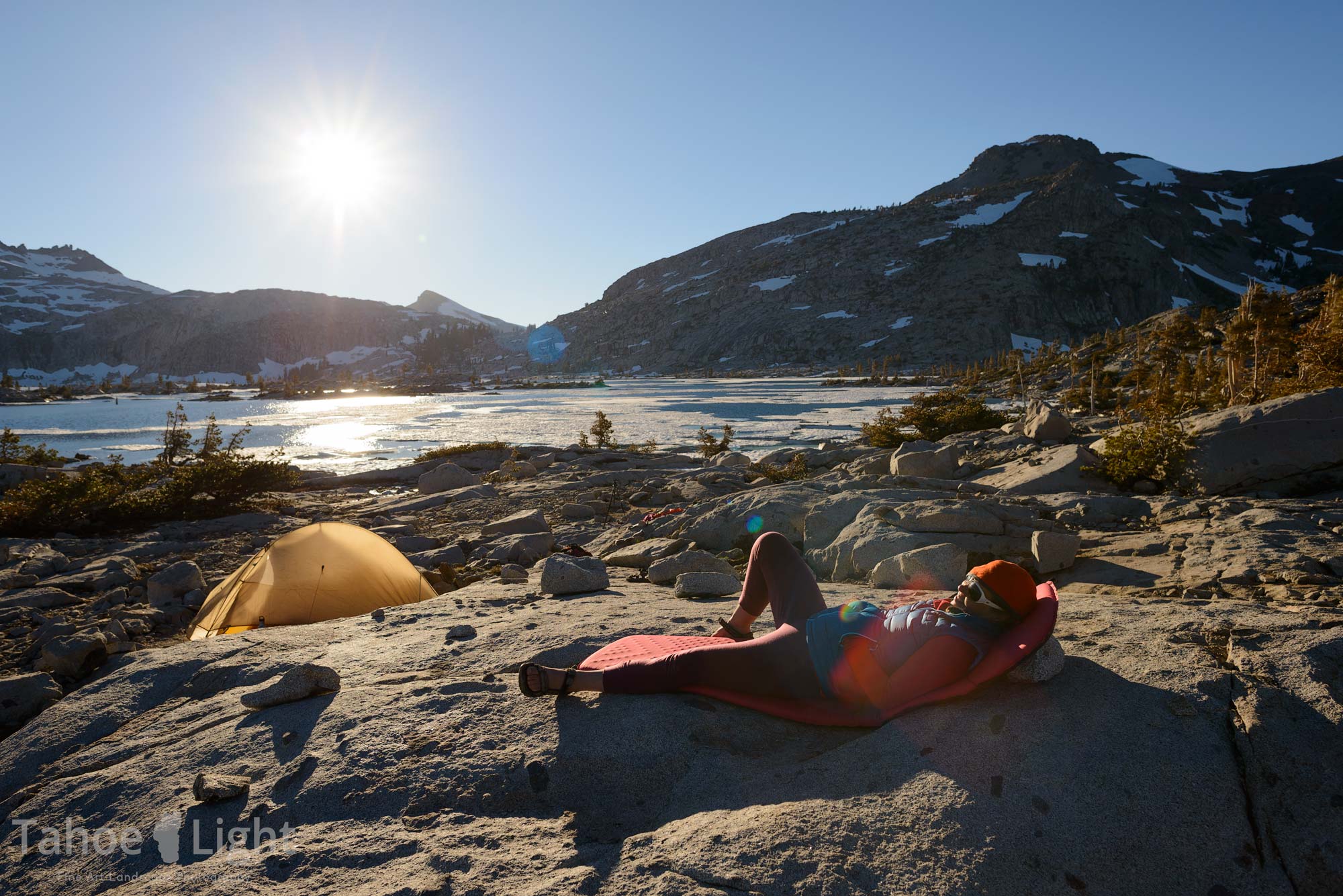 photo of backpacker camp at lake