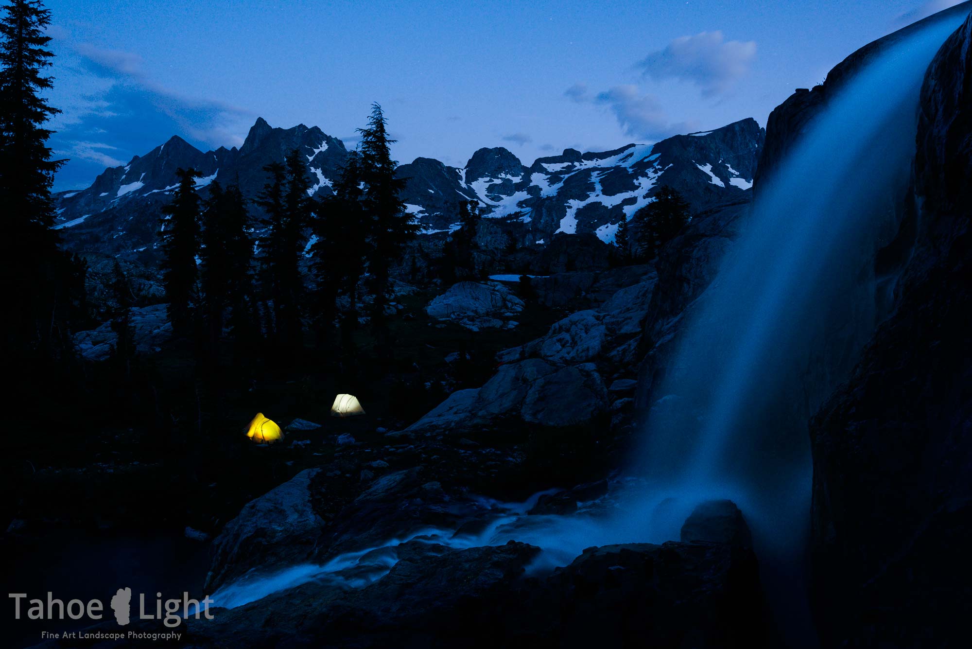 high sierra campsite under waterfall