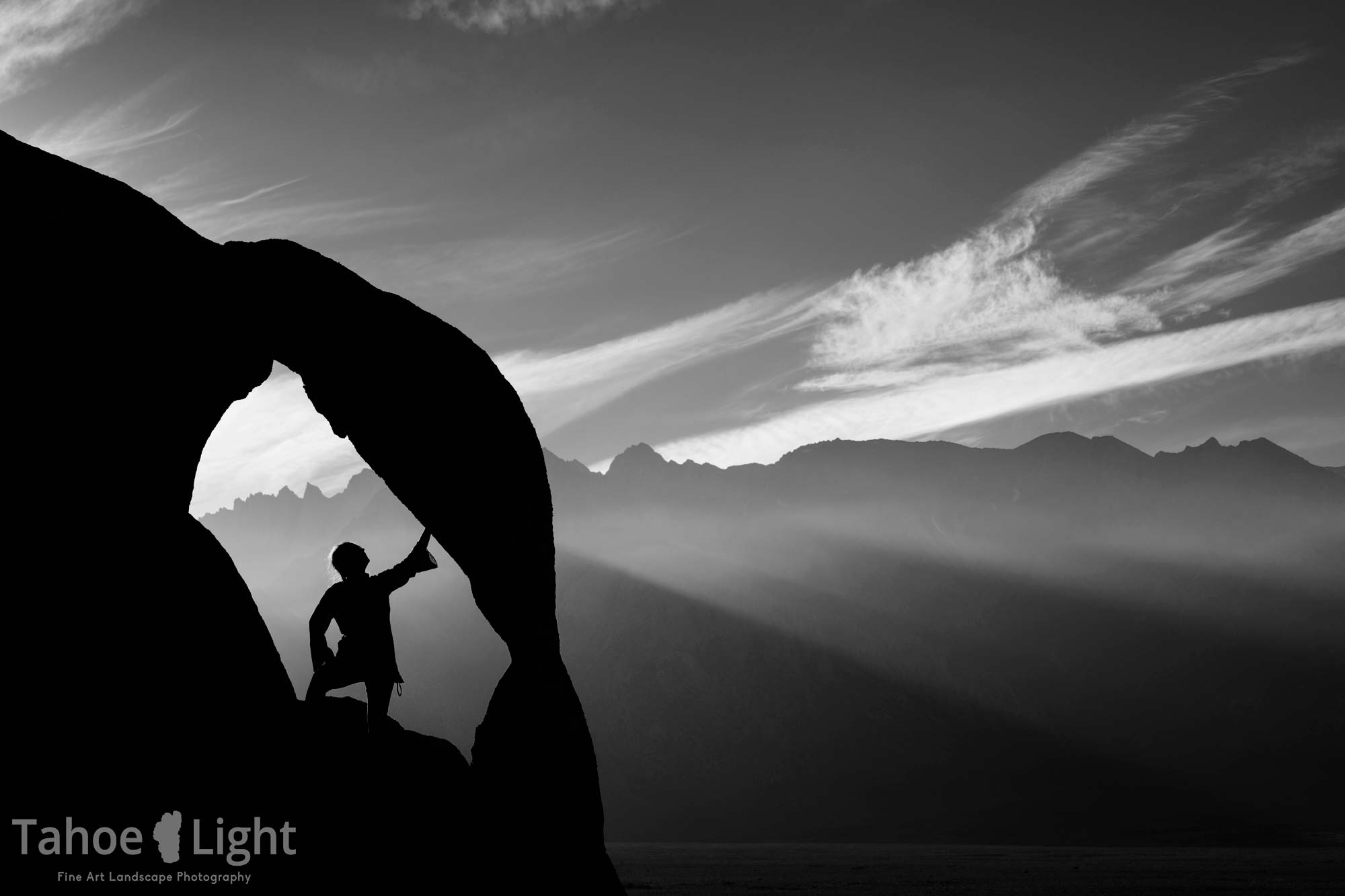 Granite arch in Alabama hills with smoke in the high sierra