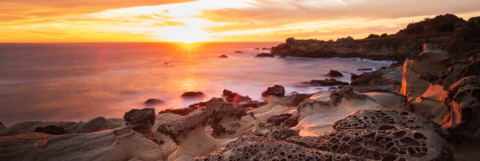 Tafoni rocks at sunset along the pacific ocean