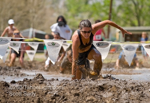 The mud pit is one of the many obstacles on the popular Run Amok foot race at the Reno River Festival.