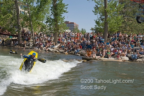 Team Jackson kayaker Stephen Wright kicking butt in front of the crowd during the invitational division for the freestyle kayaking competition at the Reno River Festival.