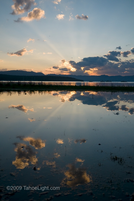 Sunrise reflected in a still pond, lake tahoe