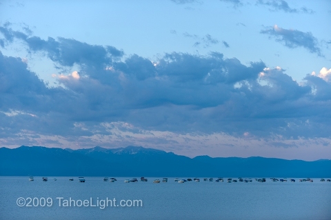 Private motorboats are moored in a seemly endless line at dawn on the north shore of Lake Tahoe