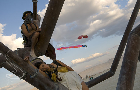 This is probably my favorite photograph from Burning man this year. Just as I was lining this peacefull shot up in what I called the metal bird's nest, a parachuter came through the frame in the background.