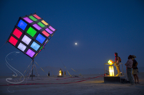 Groovik's Cube by David Lockhart at the Burning Man project in the Black Rock desert, 2009. Yes this is a fully functional giant Rubick's cube that is solvable, but you have to work with two other people to pull it off as each person controls one plane of movement.