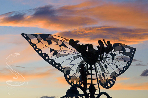 Enjoying the sunset at burning man from atop a giant metal sculpture of butterfly wings. Again, anyone with names for these installations please leave a comment so I can post them.