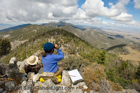 Hawkwatch International volunteer bird observers Erin Viducich and Laurel Ferreira spend the day scanning the sky and logging the birds that pass by each day.