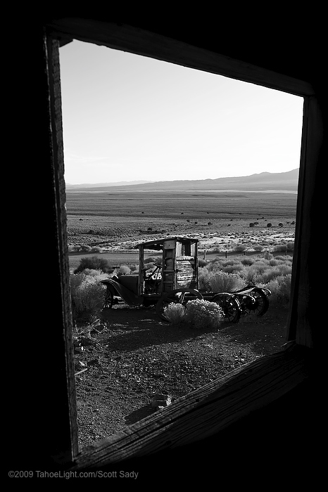 An old dodge seen through the window of the machine shop at the Berlin-Ichthyosaur state park in central Nevada. This unique Nevada state park just south of Austin combines the well-preserved ghost town of Berlin with what used to be the largest Ichthyosaur fossils in the world at 56 feet. Recently an Ichthyosaur was discovered in Canada over 70 feet long, but where do you get ghost town and dinosaur all in one visit?