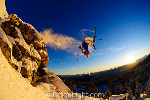 backflip on skis at sunrise