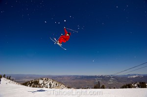big air with desert background on skis.