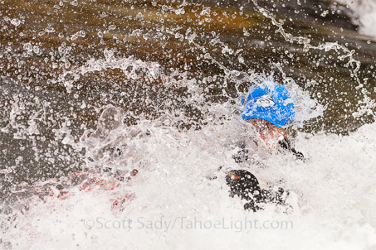 Ruth Ebens, former women's world freestyle kayaking champion in a wall of white during her ride at the Reno River Festival freestyle kayaking competition.
