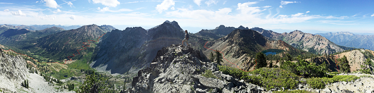 iphone panoramic picture from the top of Siligo peak. You can see the start of the loop in the background to the right of the person (me) standing on the summit. It goes down into Deer lake, then up and over to Summit, far right. Not pictured, but similar, are the ups and downs to Diamond and Luella lakes. Finally the trail picks up on the far left of the image leaving Luella lake down into the meadow by Round lake, then back up nearly 1700 vertical feet over the pass to Granite Lake.