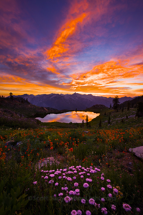 Amazing sunset over Diamond Lake in the Trinity Alps wilderness Four Lakes loop backpacking trail in California.
