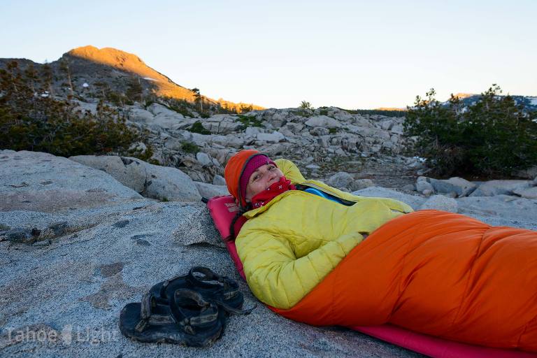 woman in sleeping bag in mountains