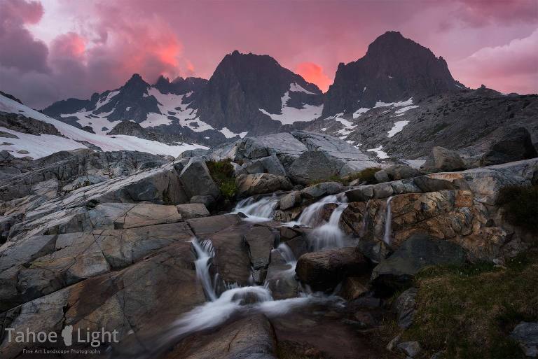 pink sunset photograph over banner and ritter peak