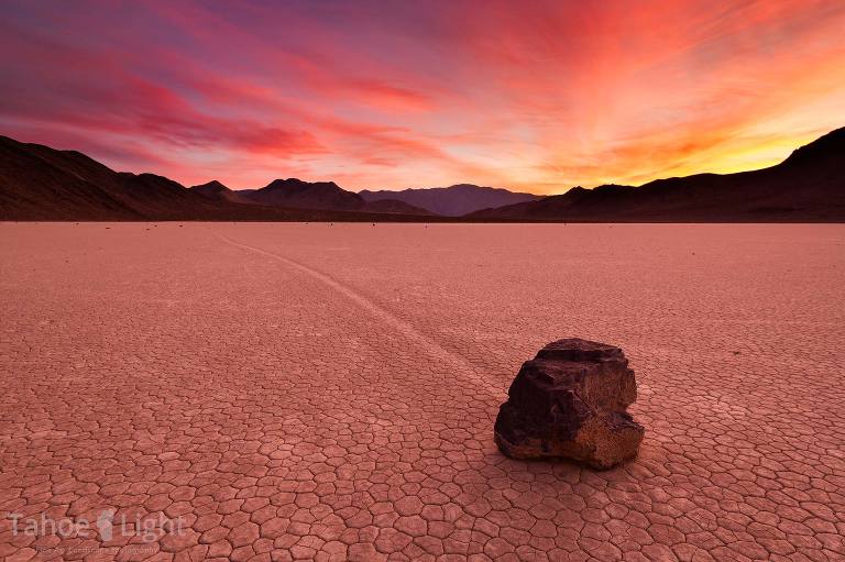 Beautiful landscape of the famous Death Valley moving rocks with a dramatic sunset.