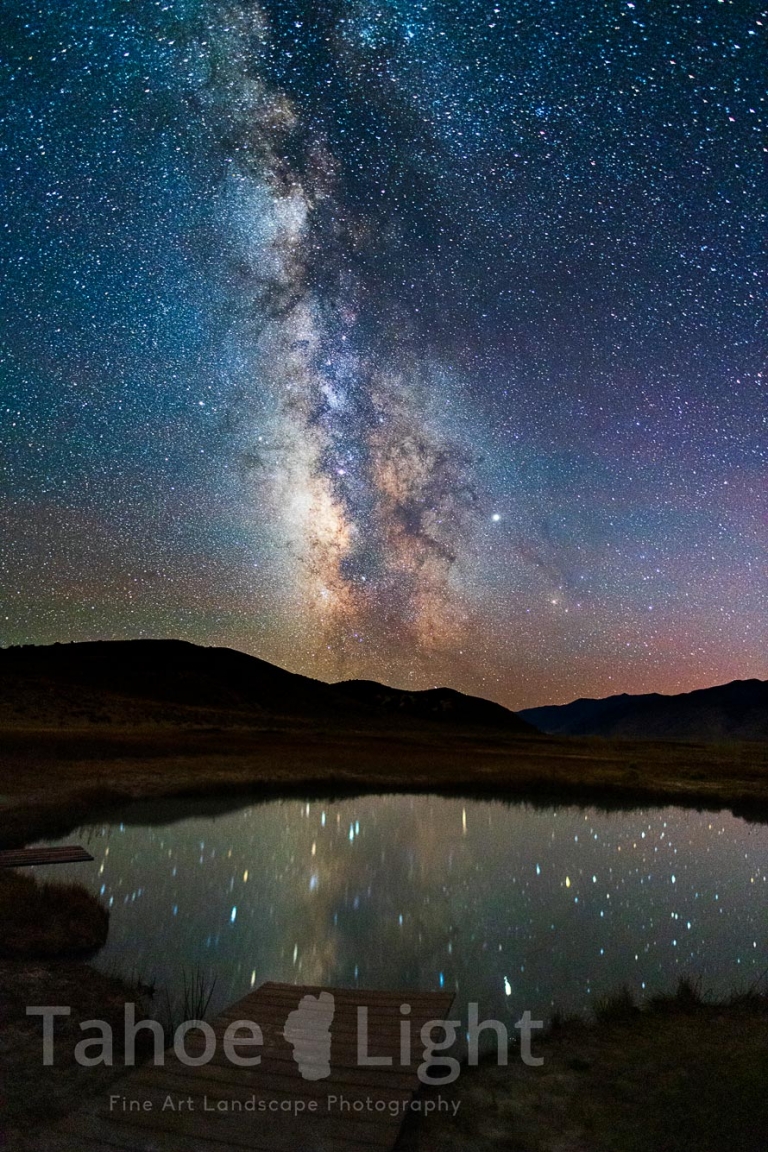 photograph of milky way over hotspring