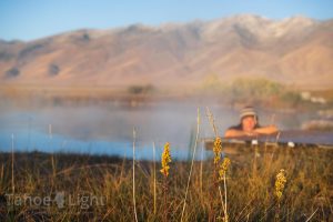 Photograph of woman getting into RUby Valley Hot Spring near Elko